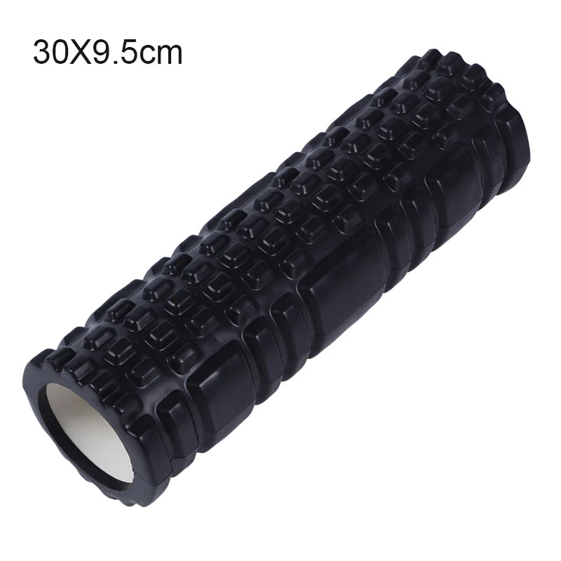 Black foam roller with textured surface on a white background