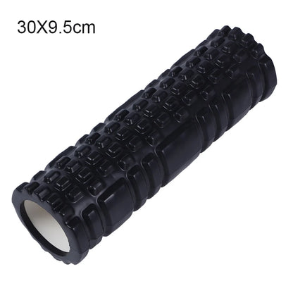 Black foam roller with textured surface on a white background