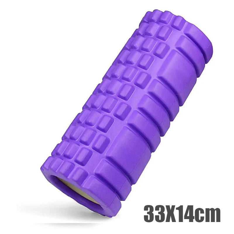 Purple foam roller with textured surface on a white background
