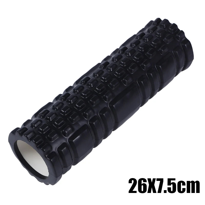 Black foam roller with textured surface on a white background
